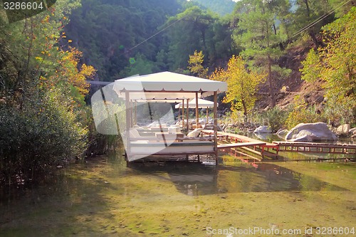 Image of Unusual restaurant with tables in  water