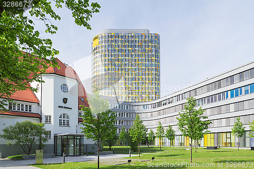 Image of Old small clubhouse and the new ADAC Headquarters tower