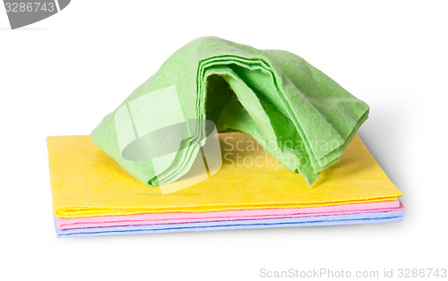 Image of Cleaning cloths crumpled on top