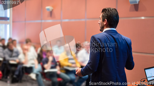Image of Speaker at Business Conference and Presentation.