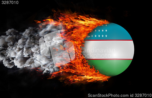 Image of Flag with a trail of fire and smoke - Uzbekistan