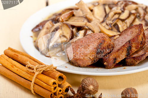 Image of venison deer game filet and wild mushrooms