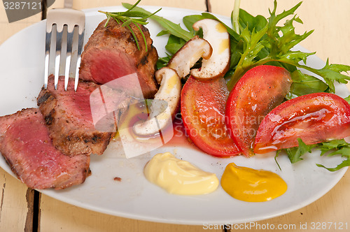 Image of beef filet mignon grilled with vegetables