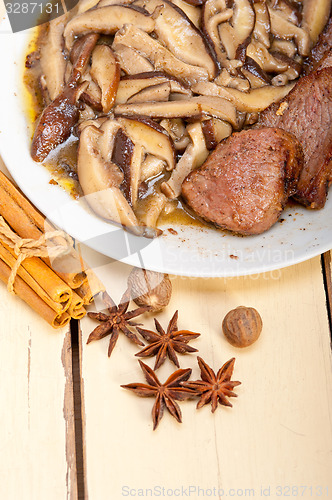 Image of venison deer game filet and wild mushrooms