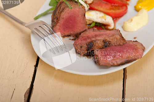 Image of beef filet mignon grilled with vegetables