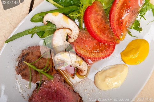 Image of beef filet mignon grilled with vegetables