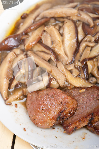 Image of venison deer game filet and wild mushrooms