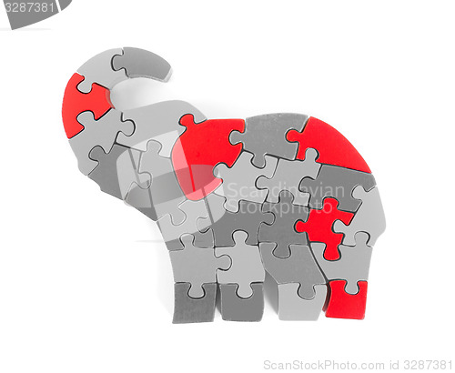 Image of Colorful puzzle pieces in elephant shape