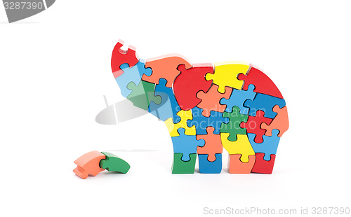 Image of Colorful puzzle pieces in elephant shape