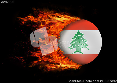 Image of Flag with a trail of fire - Lebanon