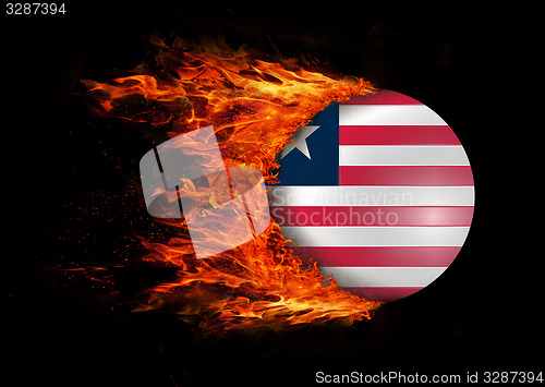 Image of Flag with a trail of fire - Liberia