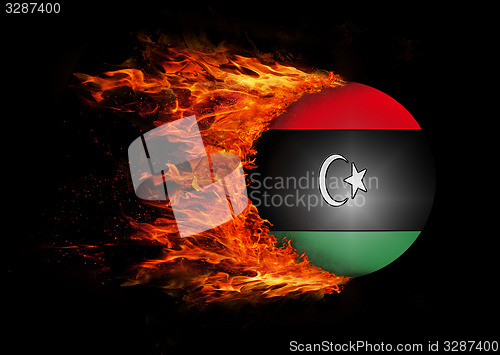 Image of Flag with a trail of fire - Libya