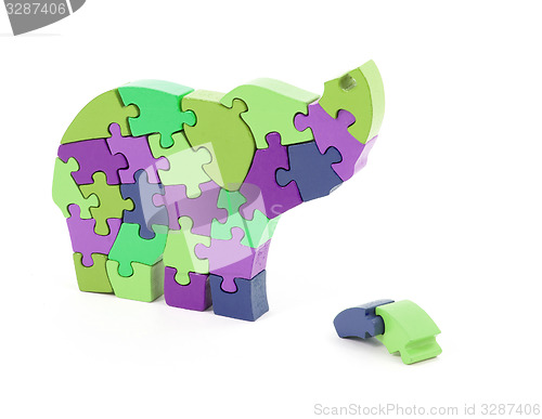 Image of Colorful puzzle pieces in elephant shape