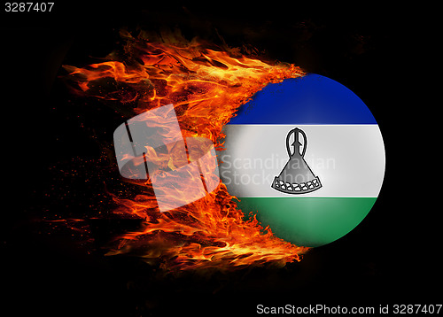 Image of Flag with a trail of fire - Lesotho