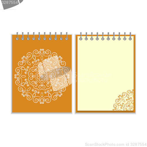 Image of Orange cover notebook with round floral pattern