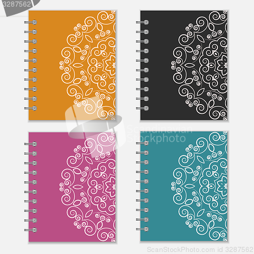 Image of Set of colorful notebook covers with flower design