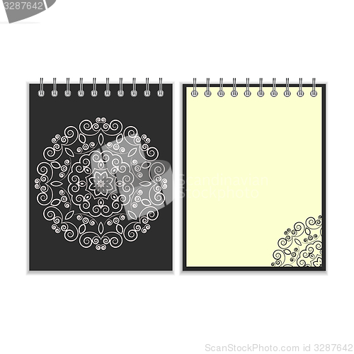Image of Black cover notebook with round floral pattern