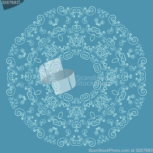 Image of Round lacy pattern on blue background
