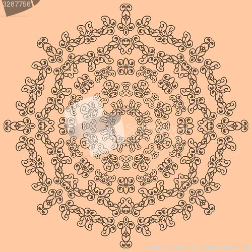 Image of Round brown ornate pattern on beige background