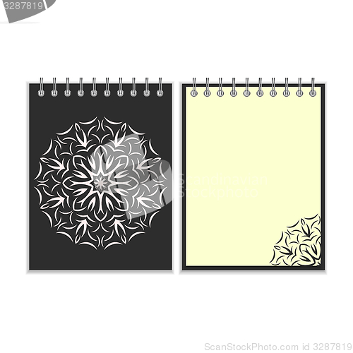Image of Black cover notebook with round florwer pattern