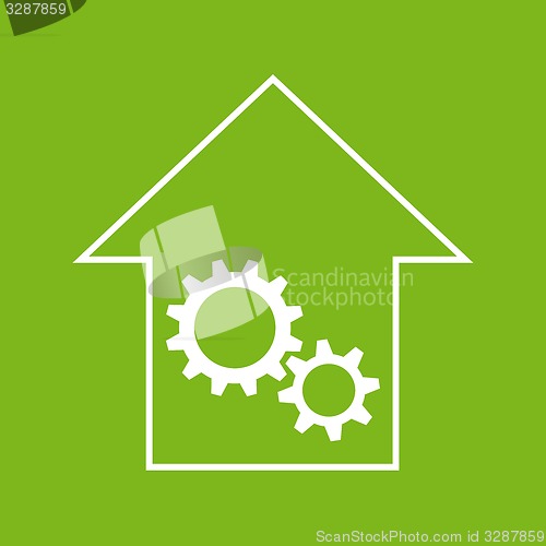 Image of White and green house with gear wheels