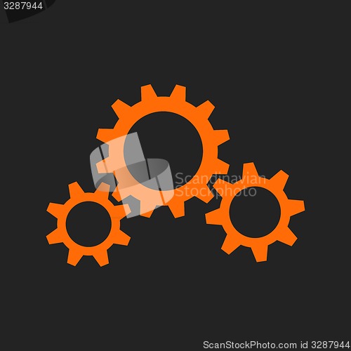 Image of Three orange gear wheels on black