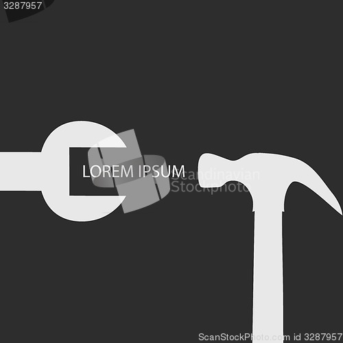 Image of White spanner with hammer on black