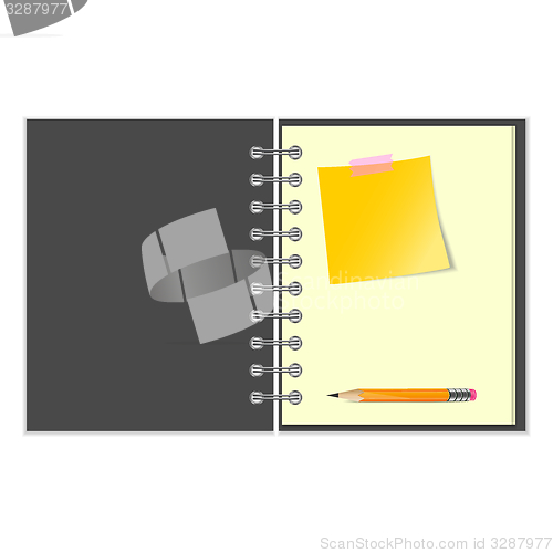 Image of Open notebook with yellow sticker and pencil