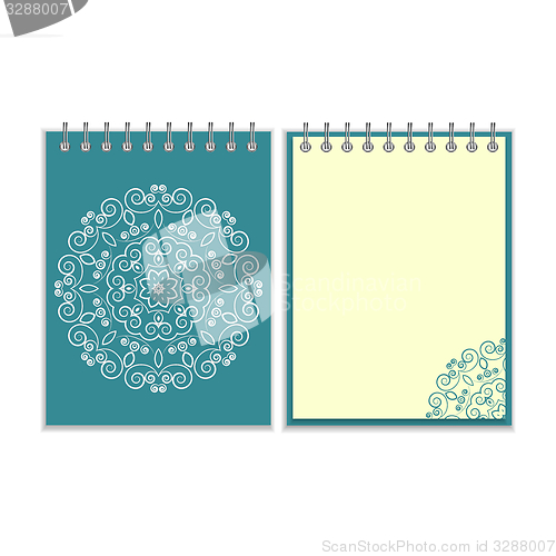 Image of Blue cover notebook with round floral pattern