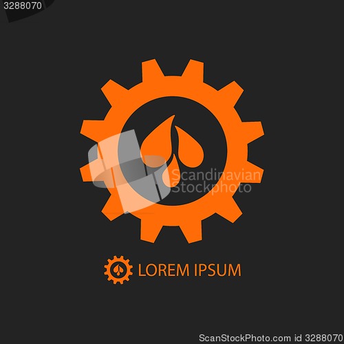 Image of Black and orange gear wheel with water drops