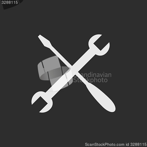 Image of White crossed tools on dark grey background