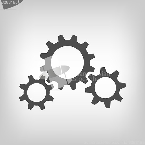 Image of Three grey gear wheels