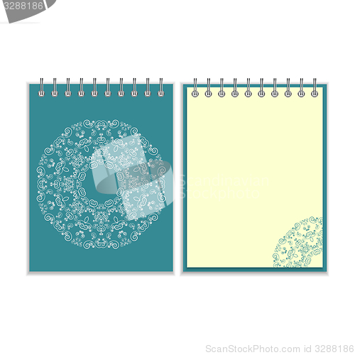 Image of Blue cover notebook with round ornate pattern