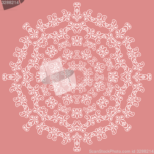 Image of Round white ornate pattern on pink background