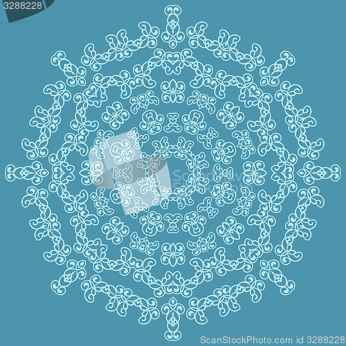 Image of Round ornate pattern on blue background