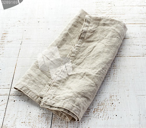 Image of linen napkin on wooden table