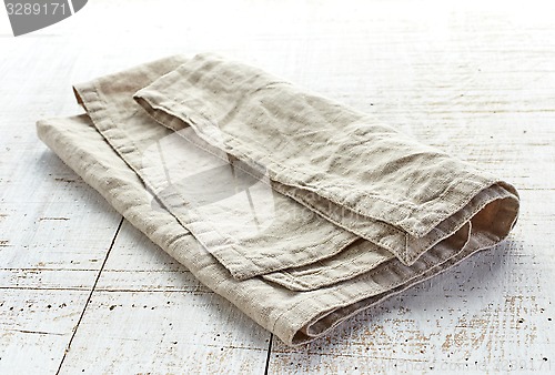 Image of linen napkin on wooden table