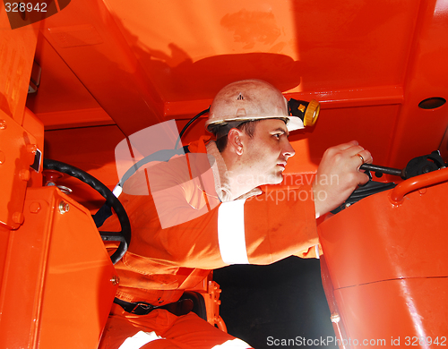 Image of Miner operating heavy machinery