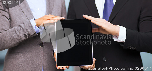 Image of businessman and businesswoman with tablet pc