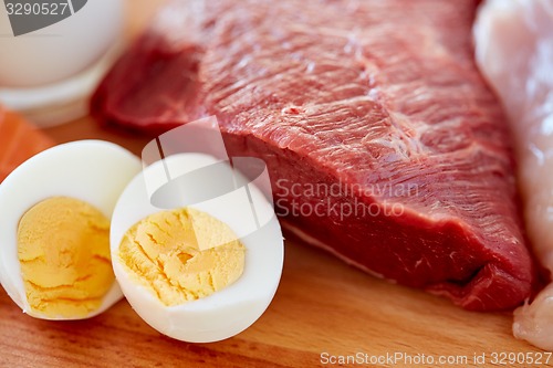 Image of close up of red meat fillets and boiled eggs