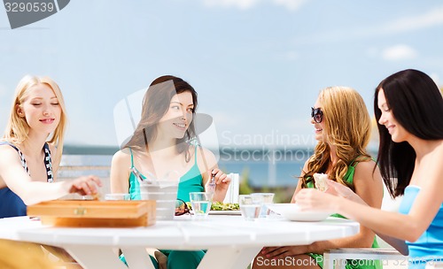 Image of girls in cafe on the beach