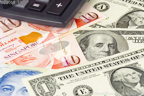 Image of Forex - US and Singapore currency pair with calculator

