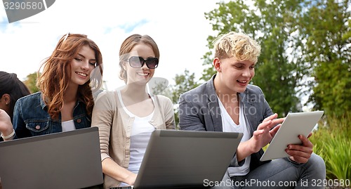 Image of students or teenagers with laptop computers
