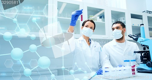 Image of young scientists making test or research in lab