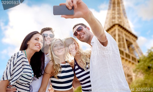 Image of friends taking selfie with smartphone