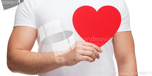 Image of closeup of man hands with heart