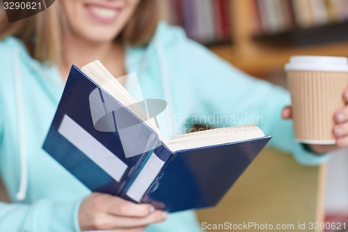 Image of close up of student reading book at school