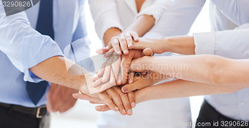 Image of business team celebrating victory in office