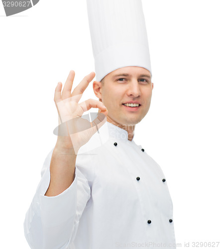 Image of happy male chef cook showing ok sign