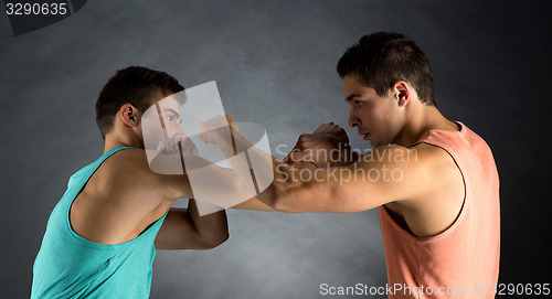 Image of young men wrestling